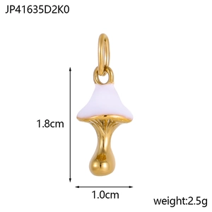 Macro view of gold mushroom pendant with white enamel detailing and 1.8cm size metrics