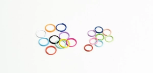 Macro detail of colorful open jump rings in various sizes for DIY jewelry crafting