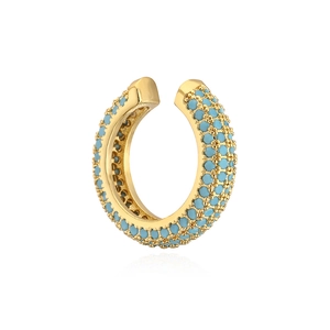 Close-up of a gold-plated U-shaped ear cuff set with turquoise stones on white background
