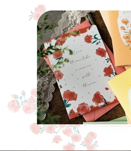 Detail of vintage 3D flower greeting card with rose illustration and color envelopes
