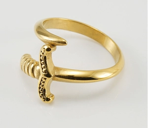 Macro shot of 18K gold plated stainless steel sword ring with detailed hilt carving