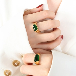 French vintage irregular gold ring set with deep green gemstone in liquid metal style
