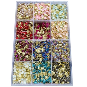 Organizer box filled with colorful heart-shaped crystal charms in various vibrant shades