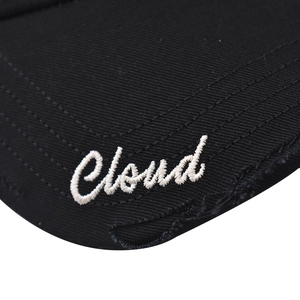 Detail of embroidered Cloud logo on black cotton cap with vintage distressed edge finish