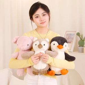 Cute soft plush pig penguin and owl stuffed animals held for cozy home comfort