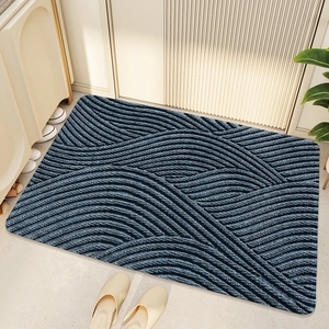 Macro view of navy blue PVC coil door mat with non-slip wavy texture for home entrance
