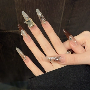 Luxury blush French almond press-on nails with 3D crystal diamonds and pearl accents