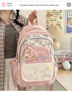 Pink and white lightweight backpack with embroidered clouds and a polka dot charm