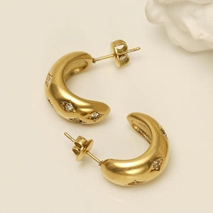 Polished gold-plated stainless steel C-shape earrings with inlaid zircon star patterns