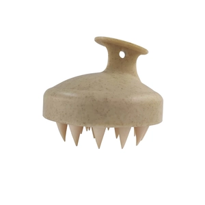 Detail of eco-friendly wheat straw scalp massage brush with soft silicone bristles