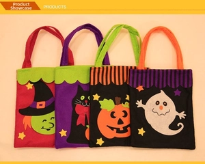 Detail of four Halloween non-woven bags with wizard, cat, pumpkin, and ghost felt patterns