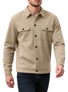 Detailed view of khaki waffle knit shirt jacket with chest pockets and black buttons