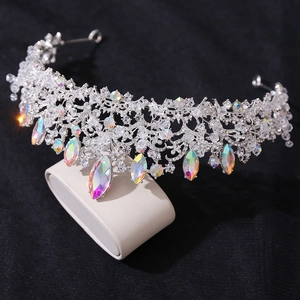 Macro detail of silver crown with marquise rainbow crystals and shimmering rhinestones
