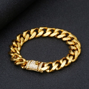Detailed view of golden stainless steel Cuban chain with ice out diamond clasp
