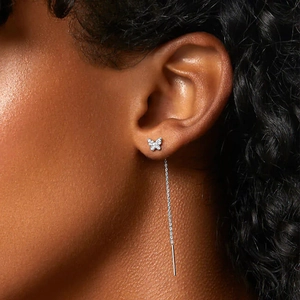 Close-up of S925 sterling silver butterfly tassel earring with white sparkling zircon