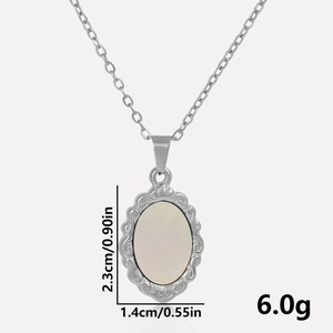 Detail view of oval white shell pendant with dimensions 2.3cm by 1.4cm and weight of 6.0g
