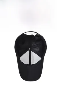 Detail of breathable mesh lining and adjustable metal buckle on black baseball cap