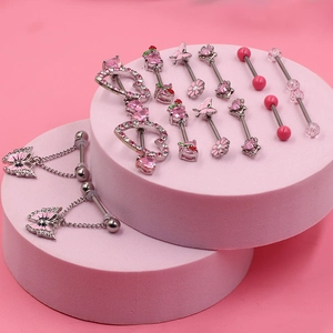 Pink zircon heart and butterfly nipple ring set in silver stainless steel on pink pedestals