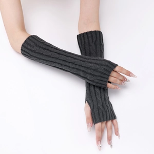 Detail of dark grey cable knit arm warmers showing long fingerless glove texture