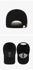 Detail view of black baseball cap with embroidered spade K and metal adjustable buckle