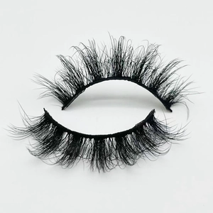 Macro shot of 20mm fluffy faux mink eyelashes with thick Russian volume and messy curl