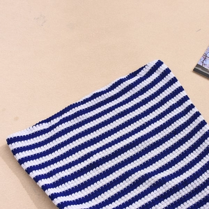 Detailed view of blue and white striped ribbed knit fabric with soft textured finish