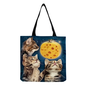Detail showing high-quality black cat print on cotton linen tote bag with starry sky design