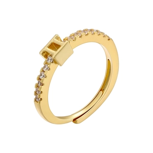 Detailed macro view of 18K gold-plated adjustable ring with small cubic zirconia stones