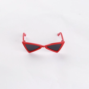 Detail of red cat-eye sunglasses for pets featuring a unique triangular frame design