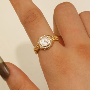 Golden watch-shaped ring with octagonal white dial and sparkling pavé crystals