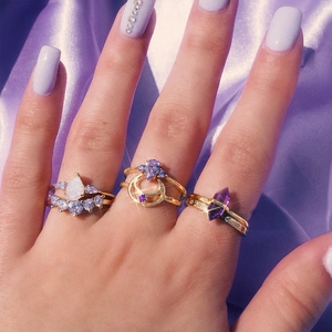Detailed view of luxury S925 silver rings set with purple crystals and zircons