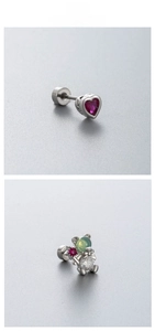 Detail of titanium steel ear studs featuring heart-shaped red gem and bear-shaped colorful stones