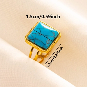 Macro shot showing dimensions of a vintage square turquoise ring with gold textured edges