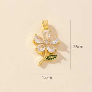 Gold plated flower pendant with cubic zirconia petals and green leaf detail 2.5cm size