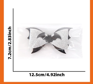 Glittery silver and black bat bow Halloween hair clip dimensions showing 12.5cm width