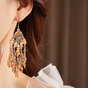 Bohemian orange and grey beaded tassel earrings with gold-tone hooks for elegant style