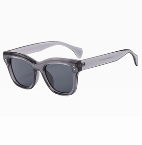 Detail of square rivet sunglasses showing transparent grey frame and model S2032S engraving