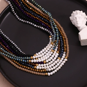 Detailed view of handmade beaded necklace with freshwater pearls and faceted glass beads