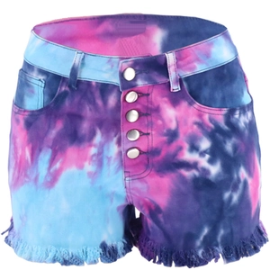 Detail of colorful tie-dye denim shorts featuring metal buttons and frayed fringe hems