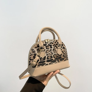 Stylish leopard print shell bag with beige PU leather handles and adjustable shoulder strap