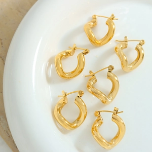 Three pairs of French minimalist gold titanium steel twisted C-shaped hoop earrings