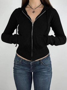 Detailed front view of women's black slim fit zip-up hoodie with ribbed knit texture