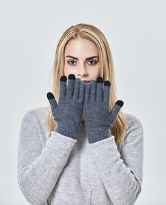 Close-up of grey knit gloves with black touchscreen conductive fingertips on three fingers