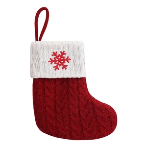 Knitted Christmas stocking with red and white color block and embroidered snowflake