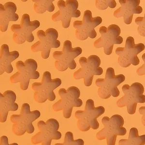 Detail of orange silicone gingerbread man mold with facial features for baking