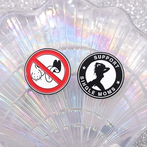 Metallic circular enamel badges with geometric designs on a pearlescent shell background