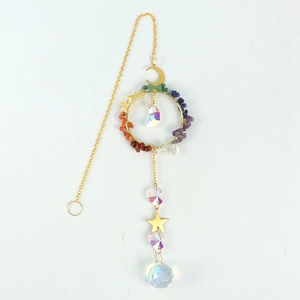 Golden suncatcher featuring a moon frame, crystal chips, and a faceted glass prism ball