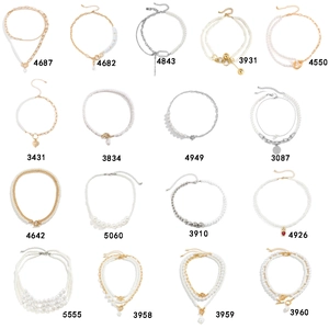 Collection of retro faux pearl and metal chain necklaces in various layered styles
