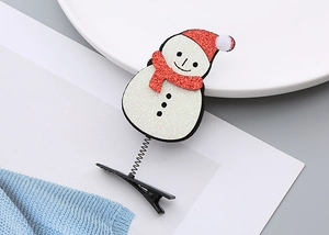 Détail de la pince à cheveux bonhomme de neige de Noël avec paillettes et ressort