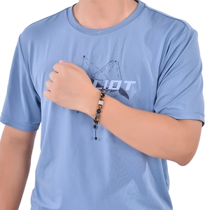 Close-up of 10mm men's beaded bracelet with black magnetic stones and adjustable drawstring